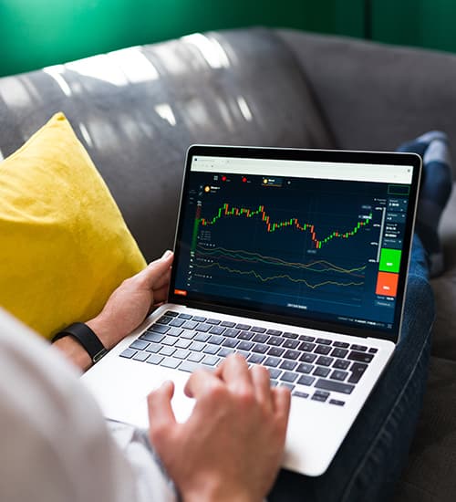 Man analyzing charts on a laptop